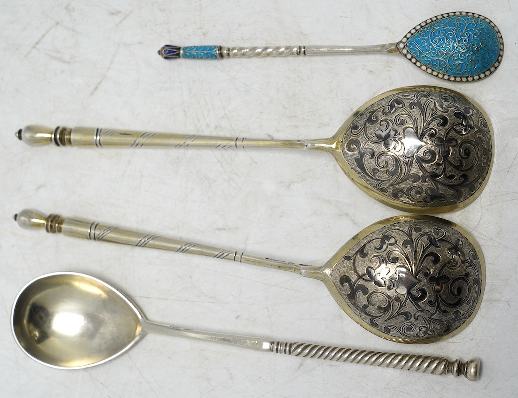 A pair of 19th century Russian 84 zolotnik and niello spoons, 15.5cm and two other Russian spoons including small spoon with cloisonné enamel. Condition - poor to fair